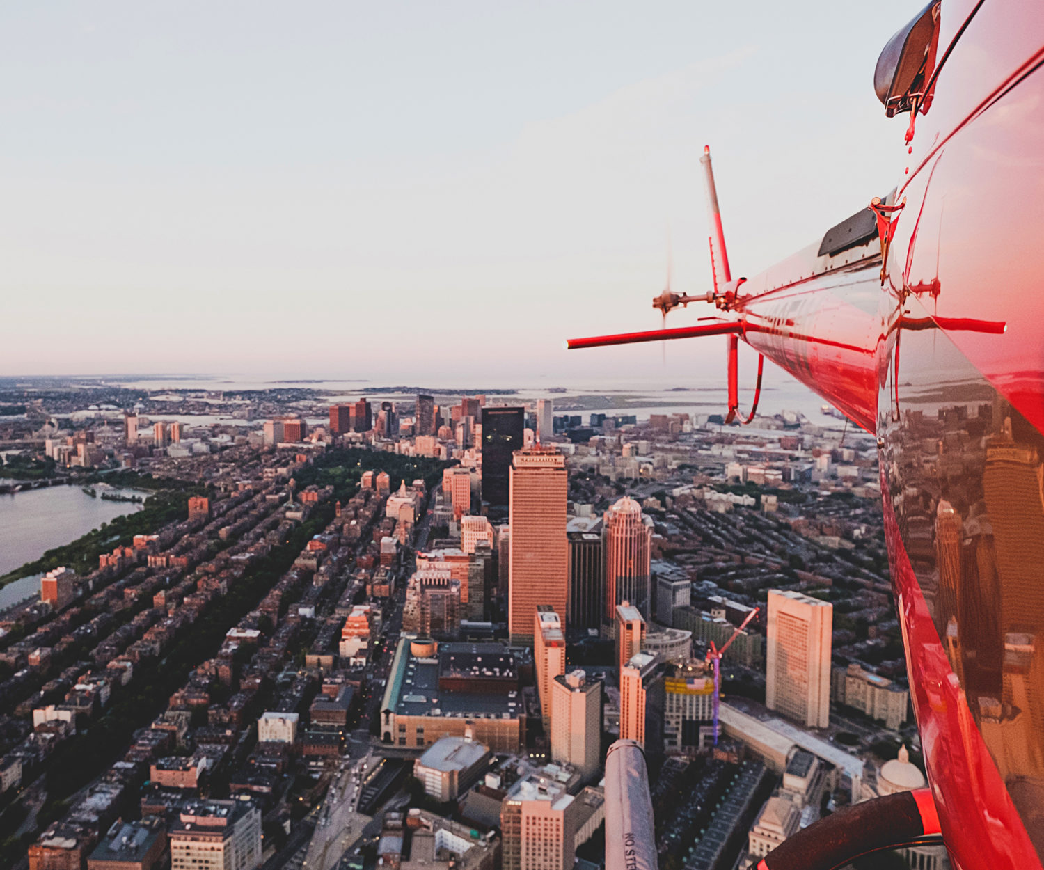 Beautiful urban city shot from a red helicopter