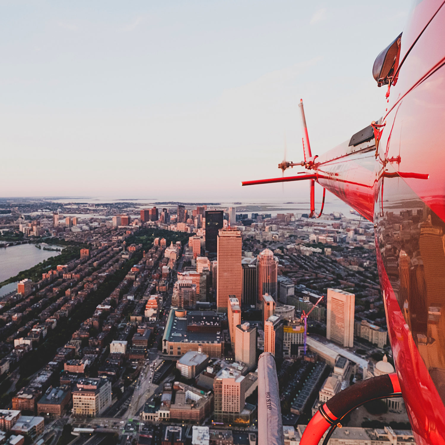 Beautiful urban city shot from a red helicopter